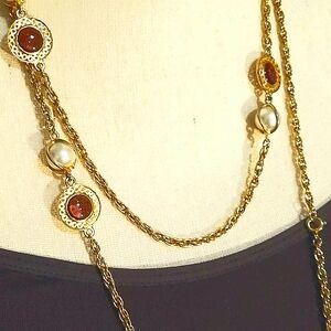 Beautiful long necklace, white pearls & purple beads. Can be worn multiple ways!